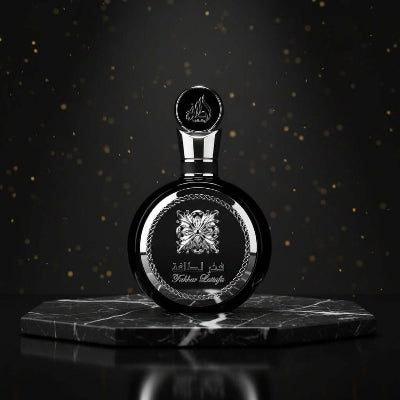 Fakhar by Lattafa perfume bottle on a marble surface, showcasing a fresh clean masculine fragrance for men.