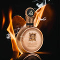 luxury unisex perfume Fakhar Gold by Lattafa in an elegant bottle, surrounded by smoke and flames.